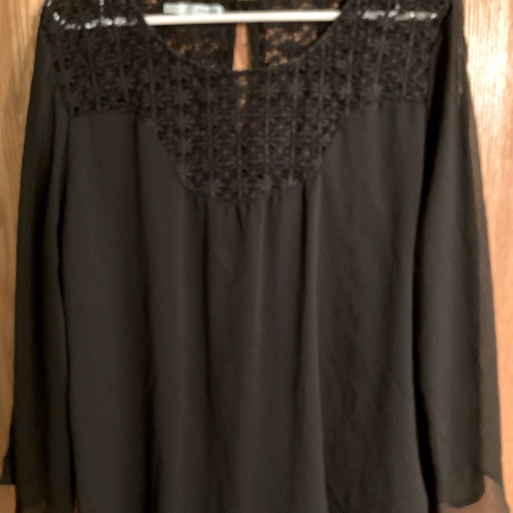 Maurice’s dark blue shirt with lace